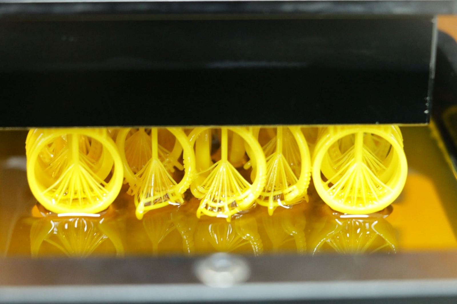 EC08 material during printing; the color appears non-green because light passes through the green-light layer